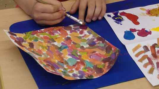 children start with painting the background