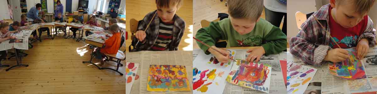 children are painting a train wagon
