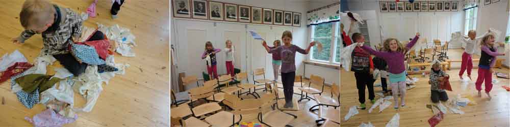 Children of the 0, 1st and 2nd class of the Hiirola school are preparing the fabric into handkerchiefs to be used for the waving wall.